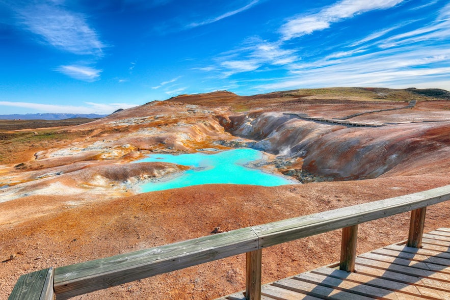 Exotic landscape of acid hot lake with turquoise water in the geothermal valley of Leirhnjukur..