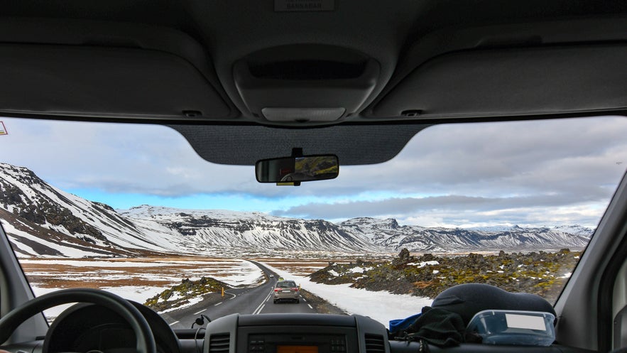 Icelandic countryside seen from inside a car on a scenic drive.