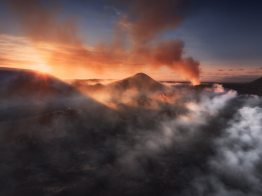 Sunset aerial of the 2023 Litli-Hrutur volcanic eruption with lava rivers and gas plumes in southwest Iceland