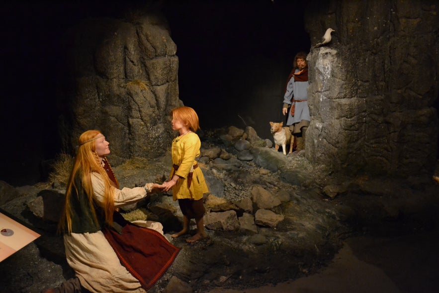 Museum diorama showing Audur the Deep-Minded with her family in a rocky Icelandic landscape.