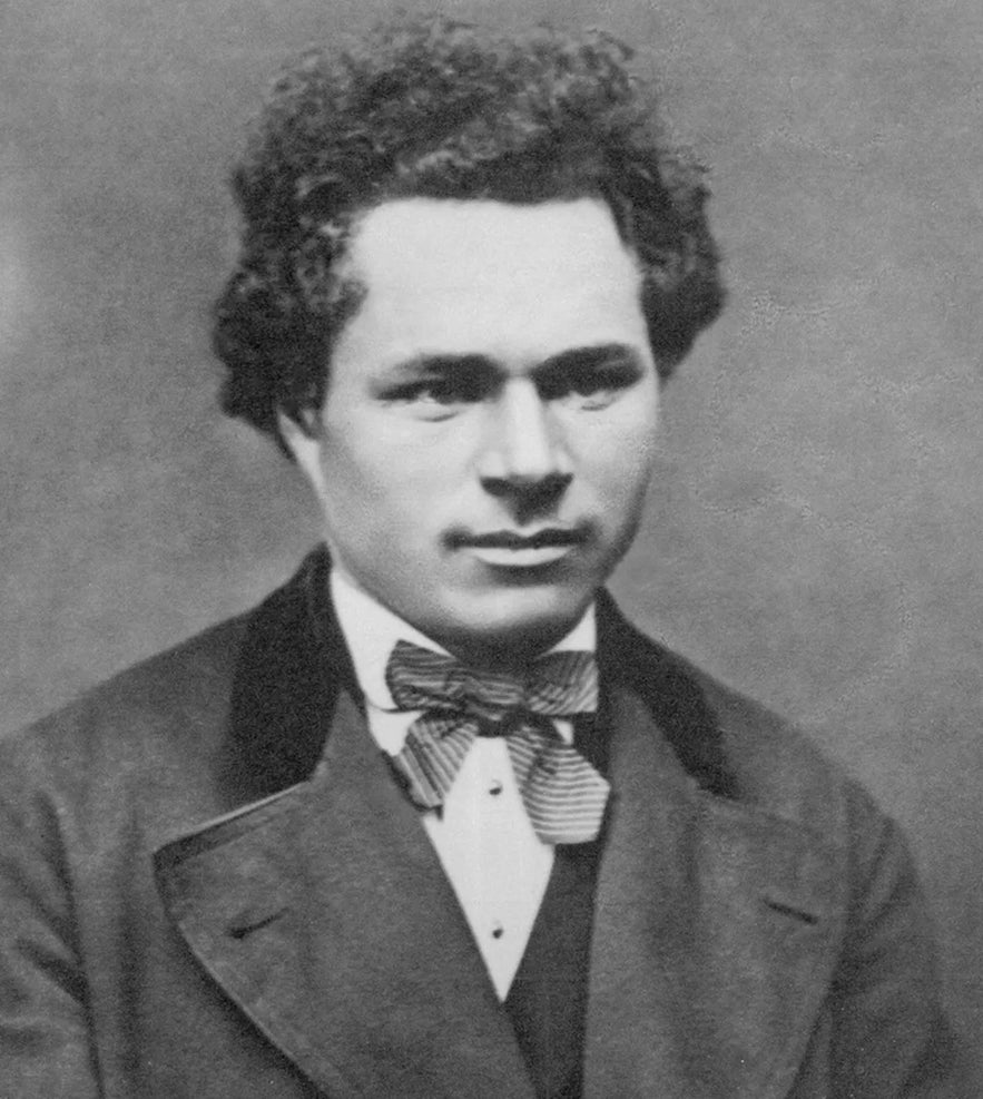 Black-and-white portrait of L&uacute;&eth;v&iacute;k L&uacute;&eth;v&iacute;ksson, grandson of Hans J&oacute;natan, wearing a suit and bow tie.