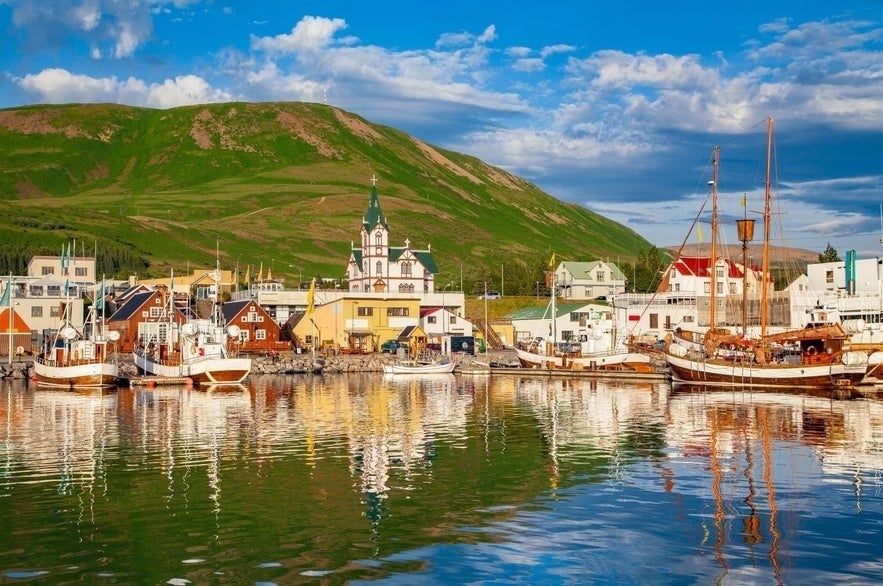 Husavik Harbor and town center in North Iceland, popular base for shore excursions in Iceland and whale watching tours.