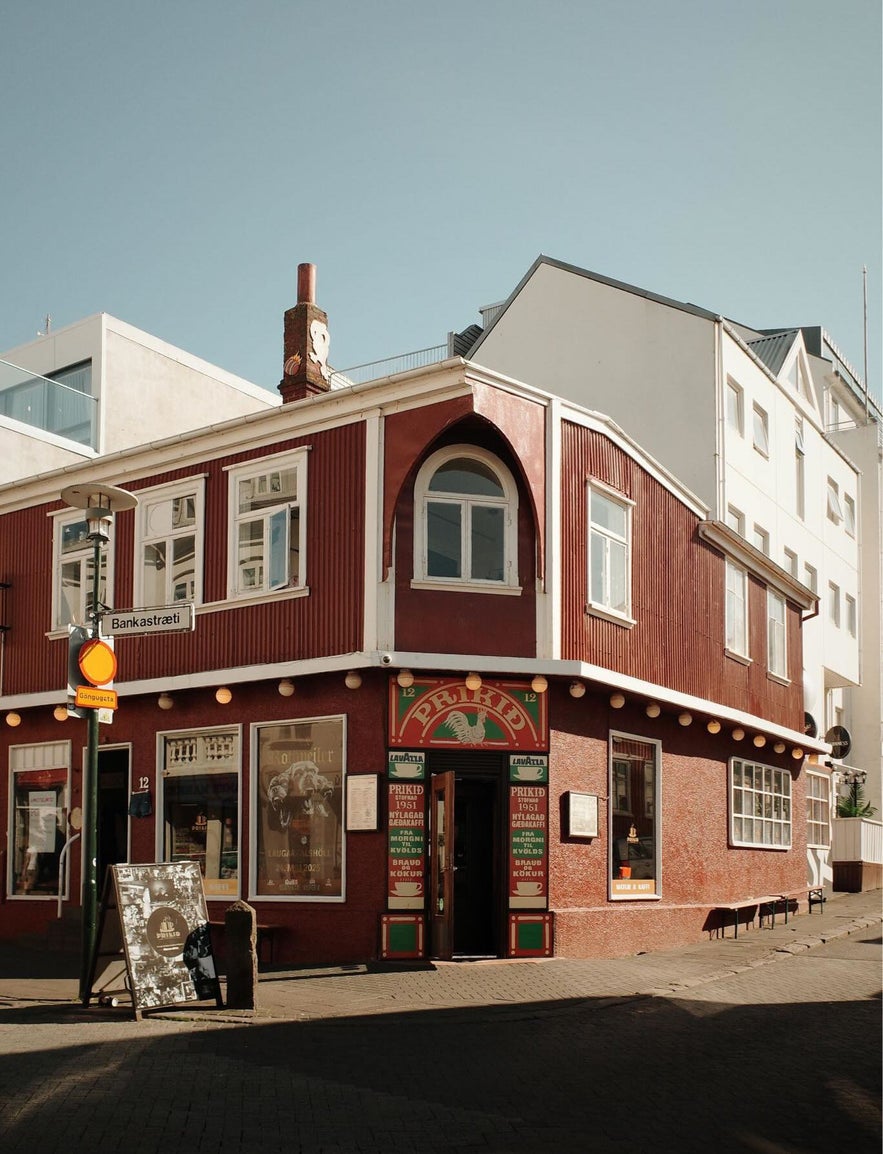 Historic red building of Prikid on Bankastraeti in Reykjavik, known for its vintage atmosphere and central location.