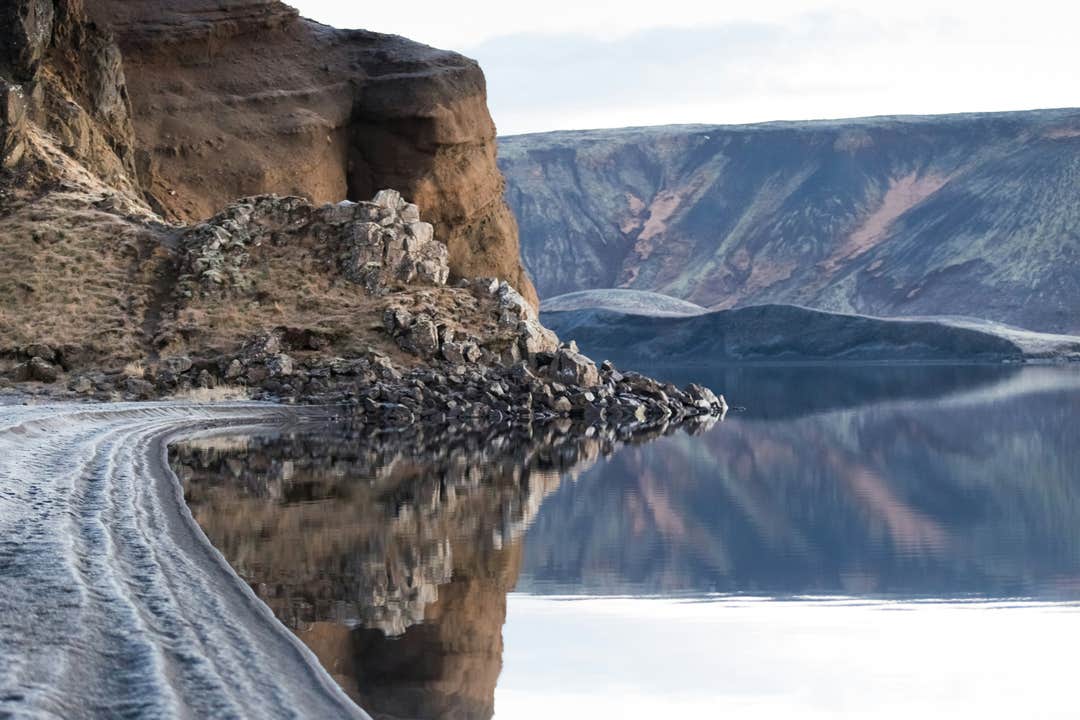Big chunks of cube-like rocks are stacked on the shore of Kleifarvatn Lake in Reykjanes Peninsula.