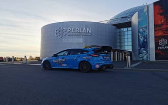 Ford Focus RS rally car taxi outside Perlan Museum in Reykjavik on a private Keflavik airport transfer.