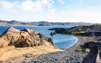 Coastal cliffs and a black sand beach on the Reykjanes Peninsula near Krysuvik.
