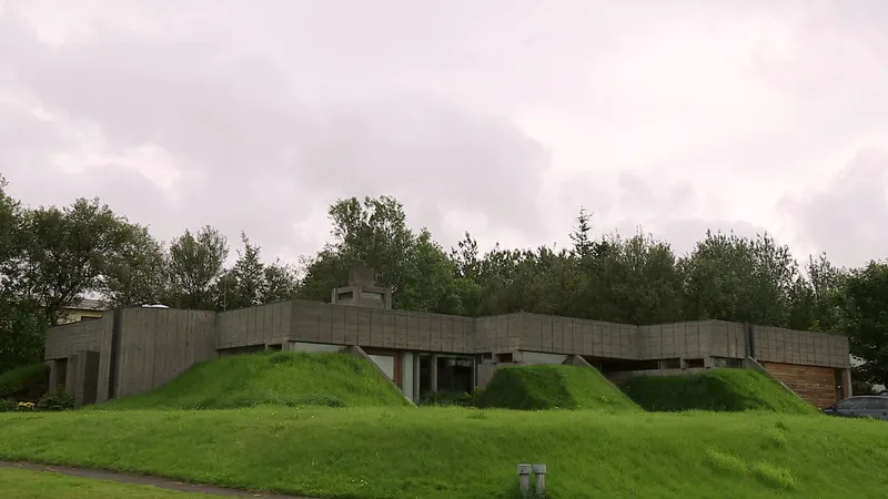 Bakkaflot 1 in Gardabaer, a brutalist-inspired modern Icelandic home featuring raw concrete walls and integrated grass berms for natural insulation. Bakkaflot 1 in Gardabaer, a brutalist-inspired modern Icelandic home featuring raw concrete walls and integrated grass berms for natural insulation.