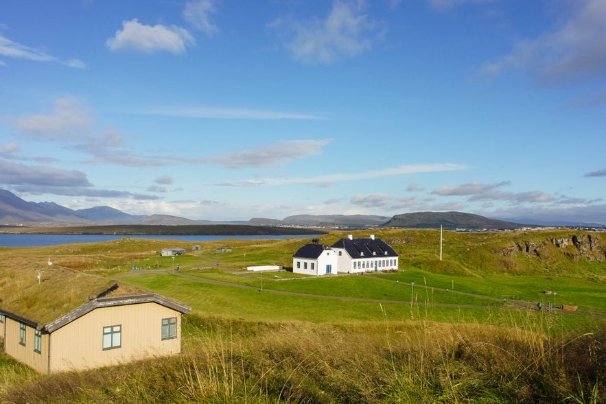 Videyjarstofa on Videy Island, the oldest stone building in Iceland, showcasing 18th-century Danish-influenced architecture set against a coastal landscape.