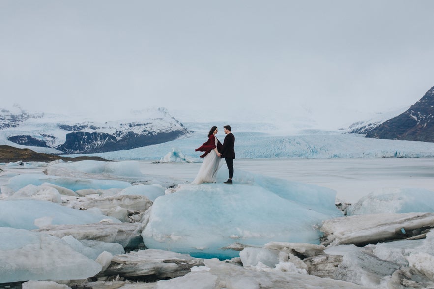 Bride and groom on an iceberg at Jokulsarlon Glacier Lagoon, Iceland. Bride and groom on an iceberg at Jokulsarlon Glacier Lagoon, Iceland.