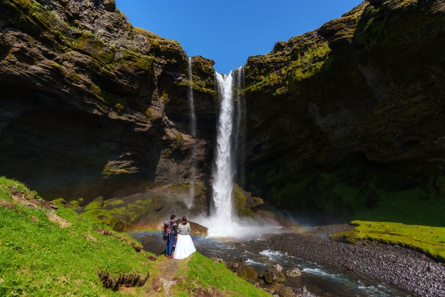 Icelandic wedding couple at Skogafoss waterfall in South Iceland. Icelandic wedding couple at Skogafoss waterfall in South Iceland.