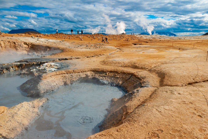 Namaskard in North Iceland with steaming fumaroles, bubbling mud pools, and mud pots boiling with geothermal energy.
