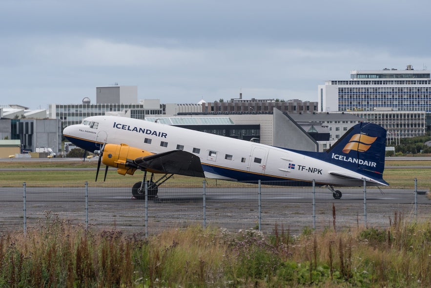 An airplane waiting on the runway at Reykjavik Airport.