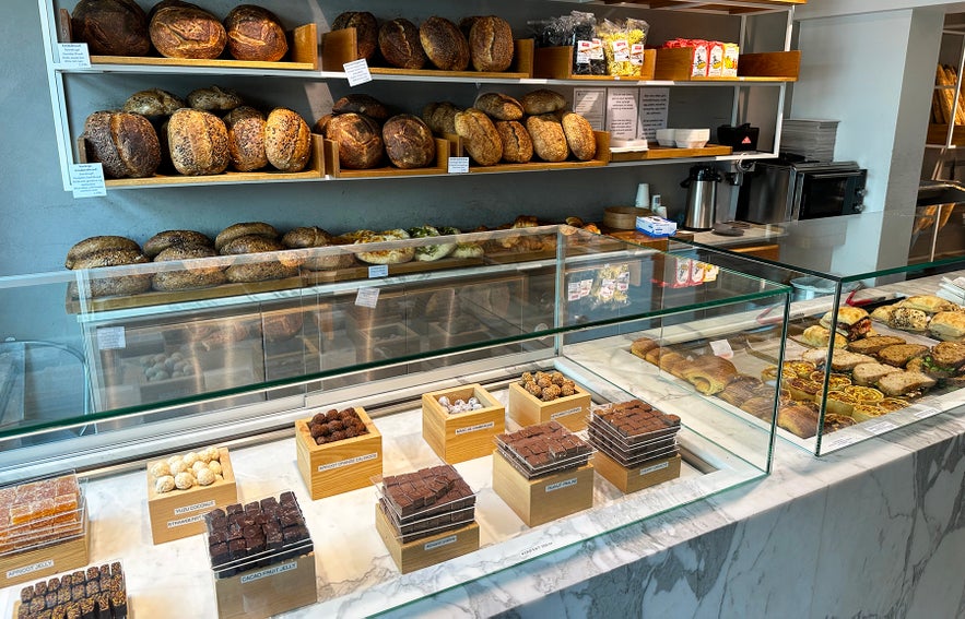 Display counter with artisan bread, pastries and chocolates at Sandholt Bakery in Reykjavík, Iceland