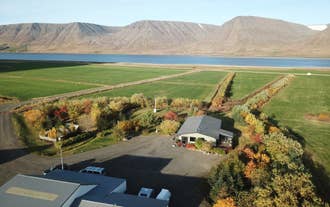 Overhead view of a beautiful farm sitting next to a fjord in the Westfjords.