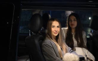 Travelers relaxing in a spacious vehicle during a private airport transfer in Iceland.