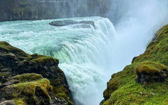 Powerful glacial water rushing through Gullfoss Waterfall in the Golden Circle.