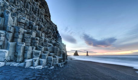 Reynisfjara beach has cliffs with hexagonal columns.