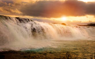 Faxi Waterfall cascading over a wide rocky ledge near the Golden Circle in Iceland.