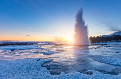 Strokkur geyser in action, a mesmerizing display of Iceland's fiery geothermal power.