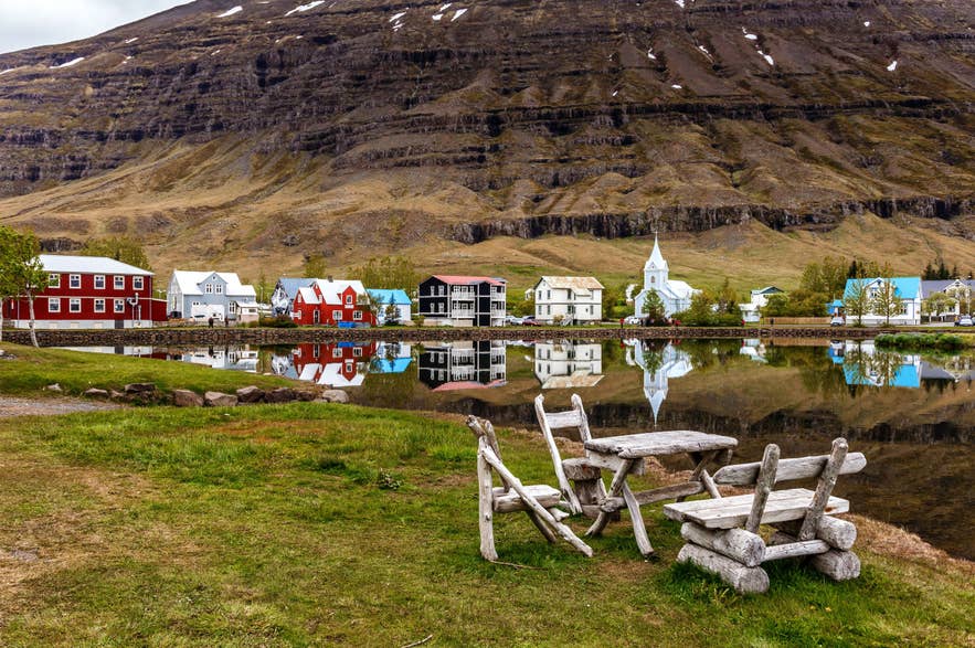 Seydisfjordur village and church reflected in fjord, East Iceland.
