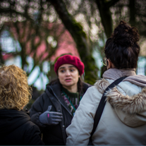 Visitors on tour, absorbed in the immersive storytelling of Reykjavik's vibrant community.