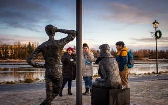 Participants engrossed in the immersive journey, connecting with the deep Icelandic worldview narrated by an immigrant guide.