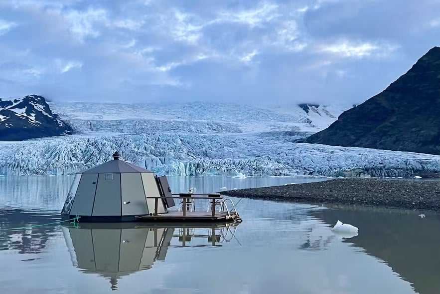 Visitors are transported to the igloo boat on a zodiac boat.