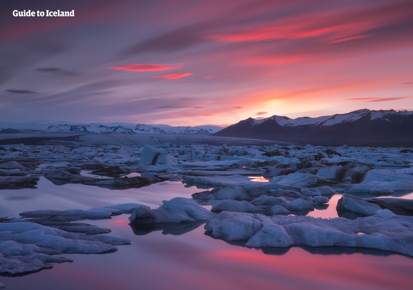 Jokulsarlon glacier lagoon in Southeast Iceland looks otherworldly at sunset.