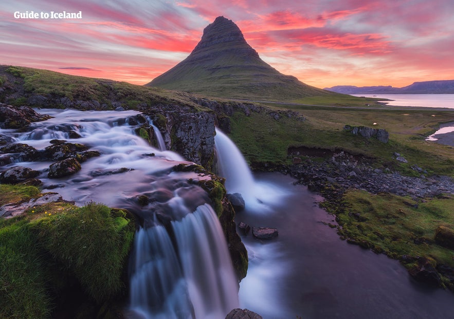 Kirkjufell mountain and Kirkjufellsfoss waterfall at sunset on the Snæfellsnes Peninsula in West Iceland.