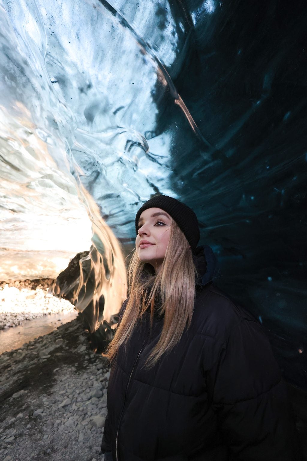 A photograph of a person in an ice cave.