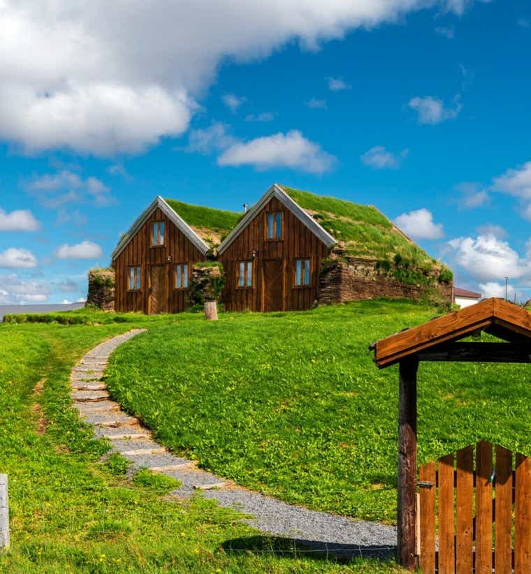 Hofn properties near the harbor in Southeast Iceland, under the blue summer sky.