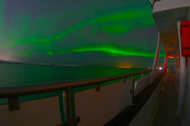 Gaze at the mesmerizing aurora borealis from the deck of the luxurious Amelia Rose on this northern lights cruise.