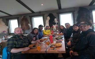A group of sight-seers smile for the camera in a restaurant in Reykjavik.