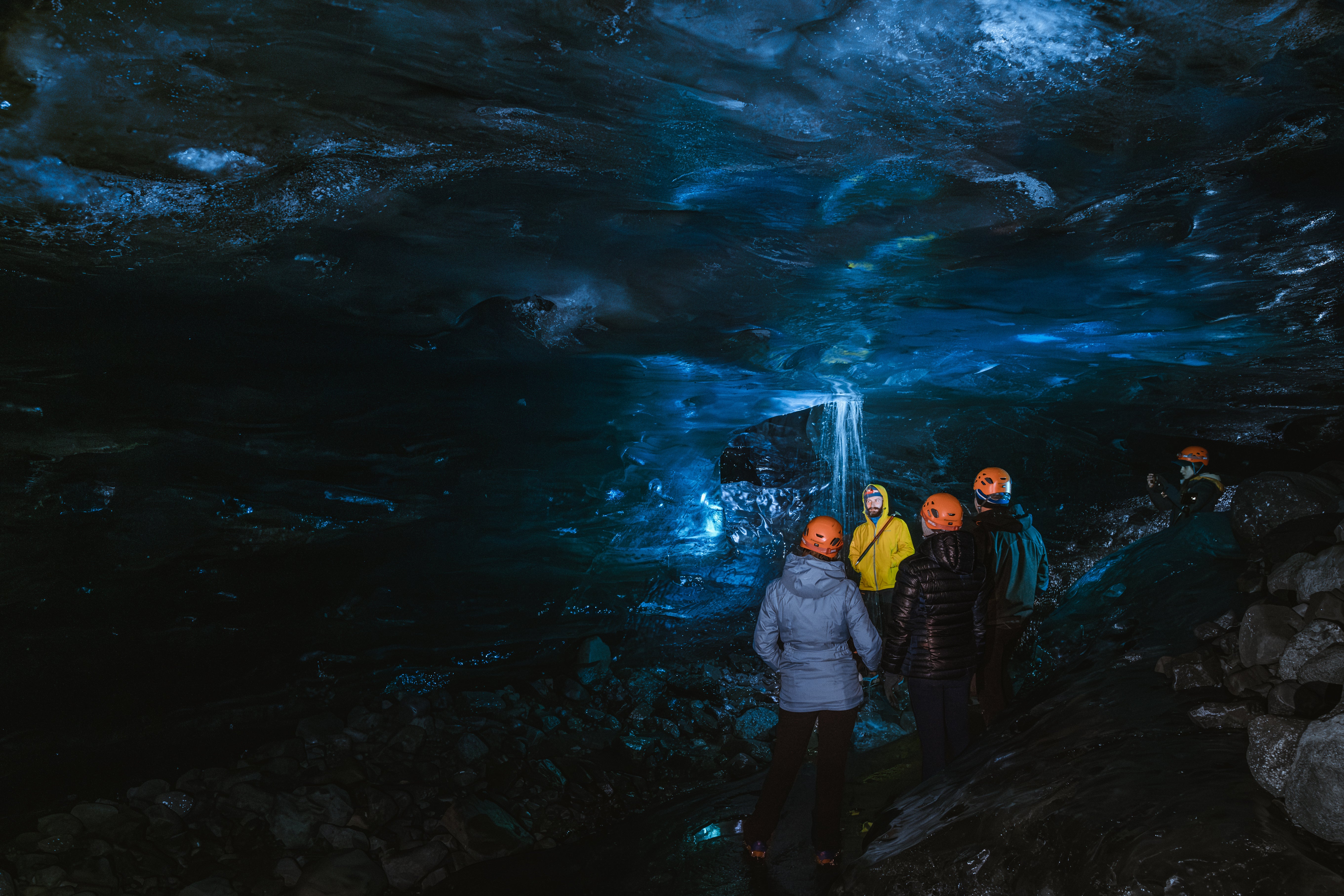 Explore the ethereal beauty of a secluded blue ice cave.