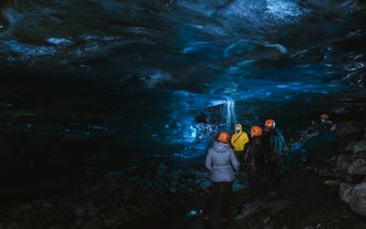 Explore the ethereal beauty of a secluded blue ice cave.