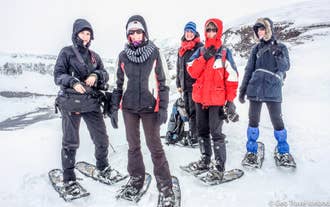 Small group preparing for snowshoe hiking tour in Eyjafjordur near Akureyri