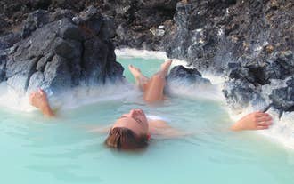 A woman floats on her back in Blue Lagoon in Iceland.