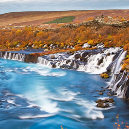 Hraunfossar waterfall is a series of cascades flowing from the Hallmundarhraun lava field.