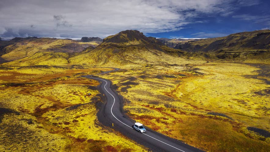A summer road leading toward Solheimajokull glacier on the South Coast, a fitting close to a July road trip.