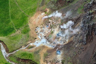 Your helicopter becomes part of the mystical scene, soaring amidst the rising steam columns for an immersive experience of Iceland's geothermal wonders.