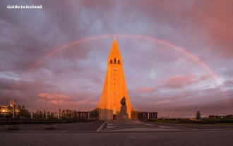 Hallgrimskirkja church with a rainbow over it in Reykjavik.