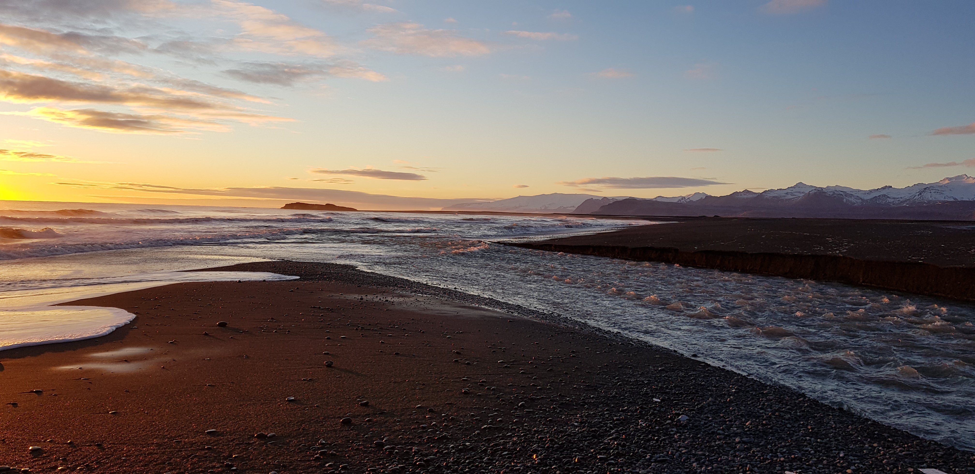 One of Iceland's black sand beaches pictured at dusk.