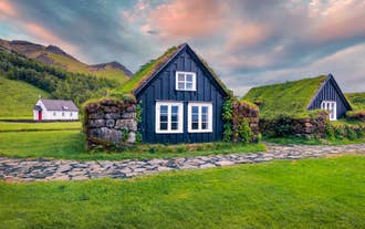A reconstructed turf house in the Arbaer Open Museum in Reykjavik, Iceland, in summer.