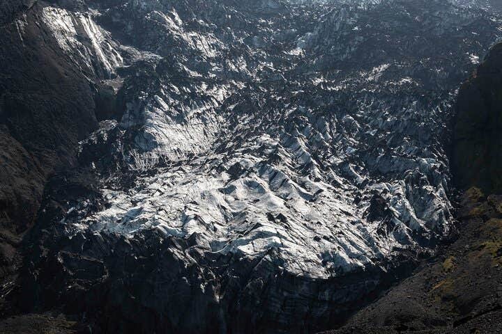 Gigjokull outlet glacier boasts ice ridges and rugged cliffs.