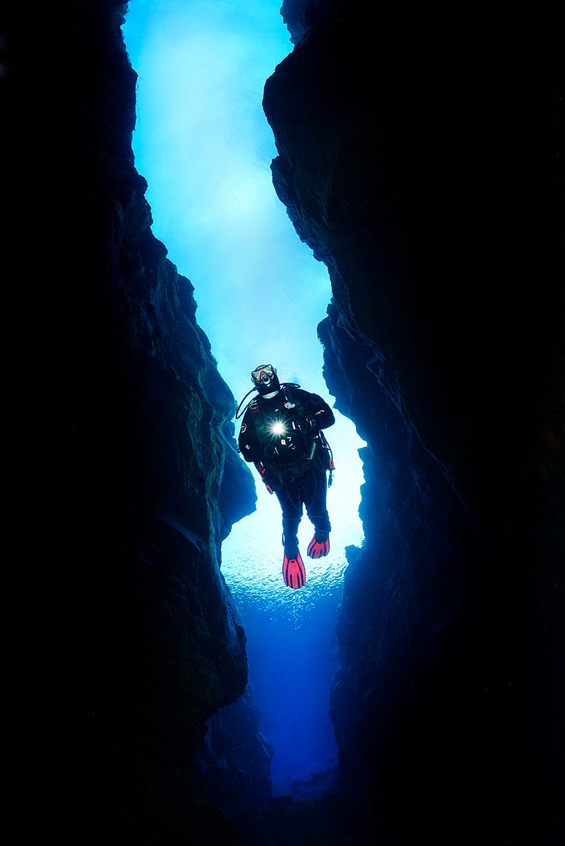 A person dives in the unique underwater world at the Silfra fissure in Thingvellir National Park.