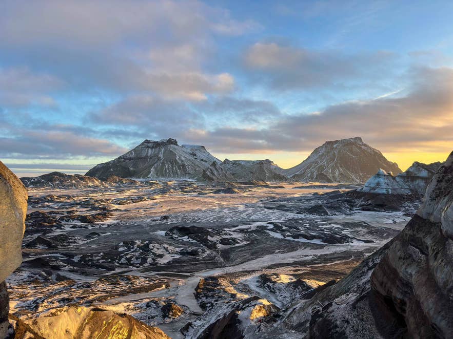 Mountain ridges and black sand plains shaped by Katla Volcano at dusk. Mountain ridges and black sand plains shaped by Katla Volcano at dusk.