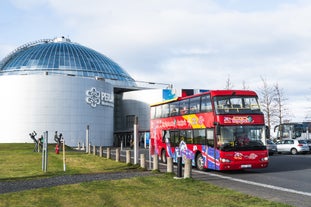 A hop-on, hop-off bus stops outside Perlan Museum in Reykjavik.