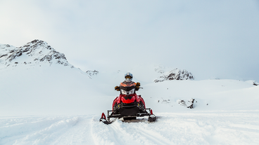 A single rider on a snowmobile tour of Langjokull glacier.