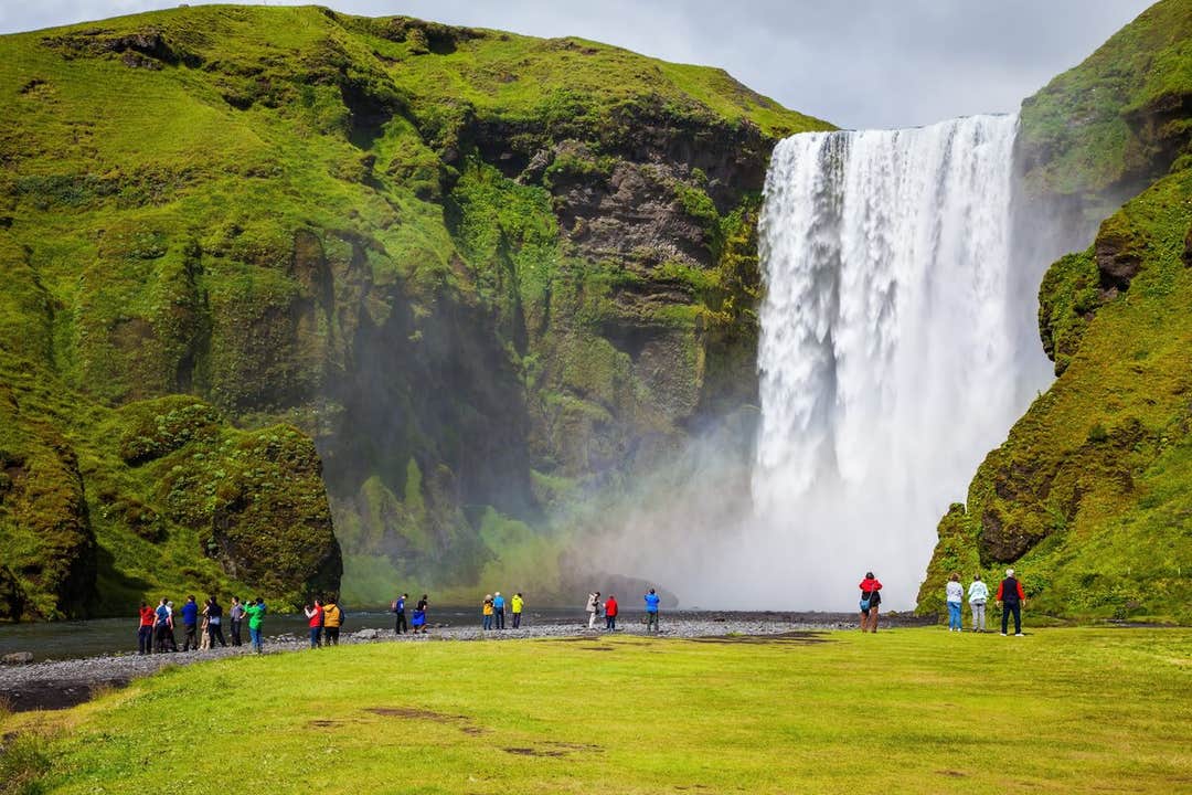 Skogafoss Waterfall plunging from a tall cliff on Iceland's South Coast.
