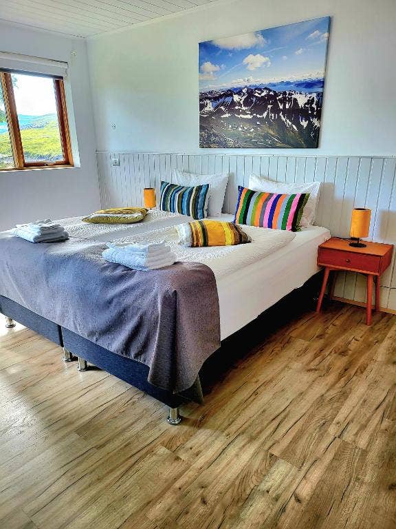 The superior double room at Hotel Flokalundur exudes spacious elegance, offering guests a stylish and roomy retreat.